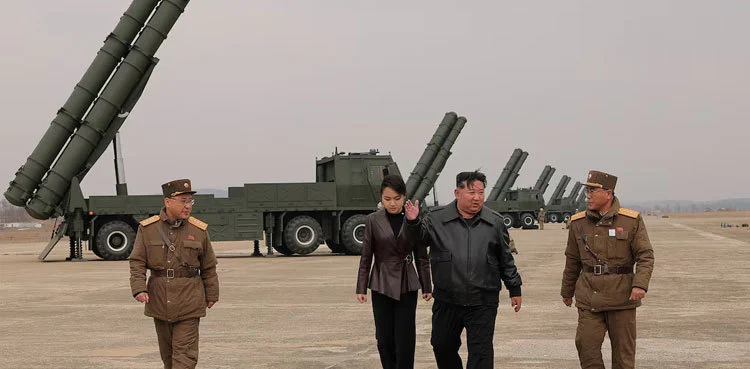 Kim Jong Un supervising a 600mm multiple rocket launcher test during a military drill in North Korea